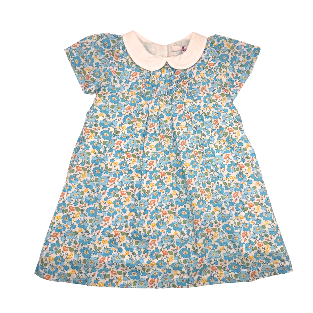 Floral dress with a white collar on a white background